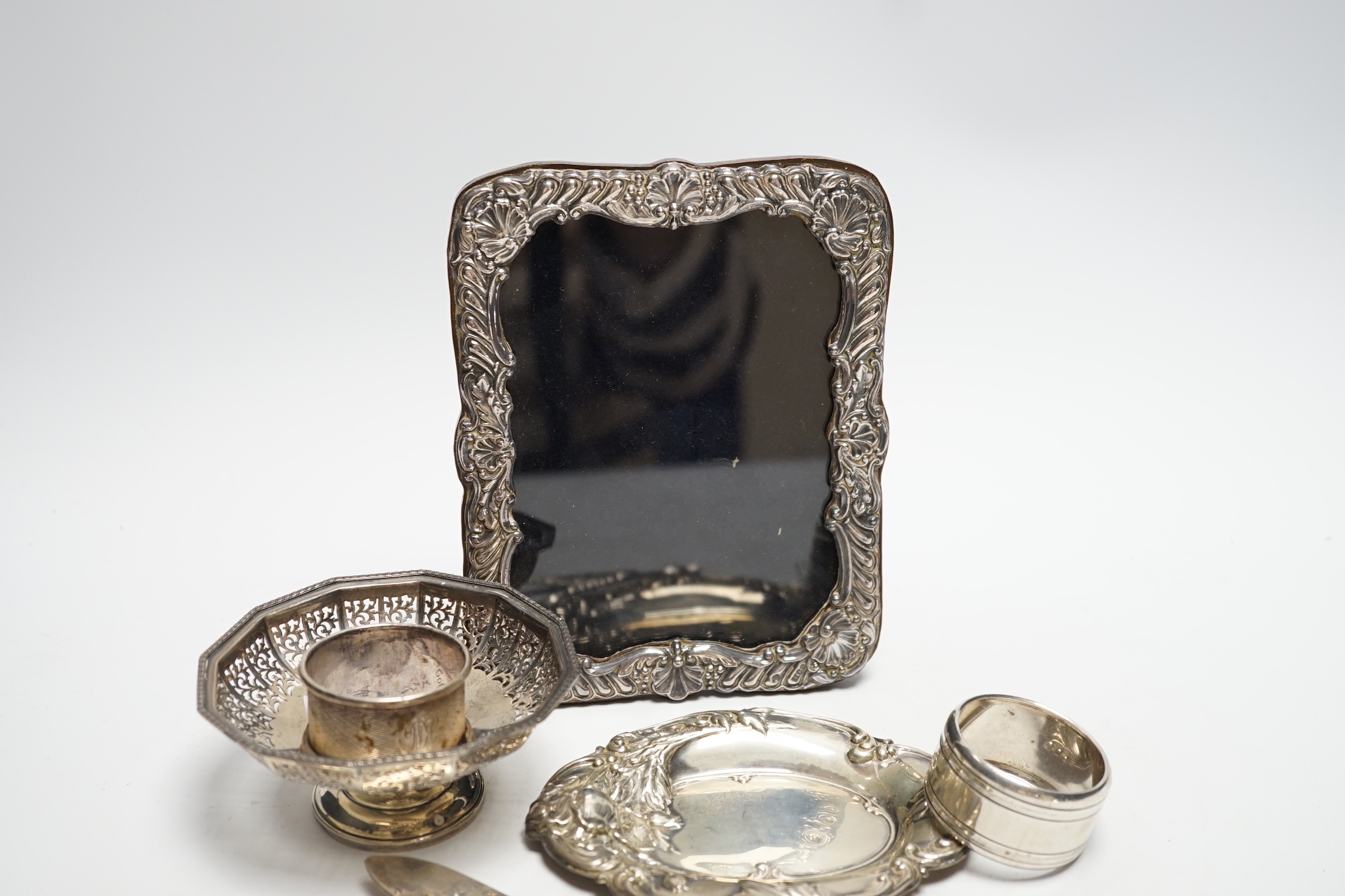 Sundry small silver and plate including a mounted photograph frame, napkin ring bonbon dish, plated butter knife, etc.